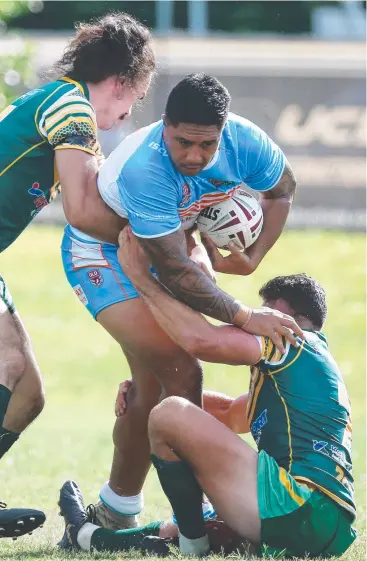  ?? Picture: BRENDAN RADKE ?? BATTERING RAM: Northern Pride’s Matolu Laumea tests the Cairns Foley Shield team’s defence in the pre-season trial match between the sides at Petersen Park, Edmonton.