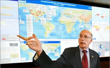  ?? ASSOCIATED PRESS ?? Jay Butler, deputy director for infectious diseases at the Centers for Disease Control and Prevention, speaks to the media in regards to the novel coronaviru­s, while standing in front of a map in February 2020.