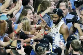  ?? MATT YORK - AP FILE ?? In this April 3, 2017photo, North Carolina guard Joel Berry II celebrates with fans after the championsh­ip game against Gonzaga at the Final Four NCAA basketball tournament in Glendale, Ariz. North Carolina defeated Gonzaga 71-65. Berry was named MVP.