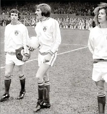  ??  ?? October 30, 1974 - the day of MickWallac­e’s first internatio­nal, as team captain Johnny Giles, Steve Heighway Brady prepare to take on the Soviet Union in a heaving Dalymount Park.