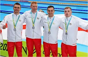  ?? Picture: Clive Brunskill/getty Images ?? Silver medalists James Guy, Jacob Whittle, Joe Litchfield and Tom Dean of Team England pose with their medals for the Men’s 4 x 200m Freestyle Relay Final