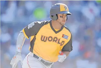 ?? GARY A. VASQUEZ, USA TODAY SPORTS ?? World infielder Yoan Moncada had a home run and a single during his first four at- bats in Sunday’s Futures Game.