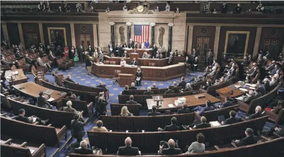  ?? J. SCOTT APPLEWHITE/AP ?? Speaker of the House Nancy Pelosi, D-Calif., and then-Vice President Mike Pence officiate as a joint session of the House and Senate convenes to confirm the Electoral College votes cast in the November 2020 election, at the Capitol in Washington on Jan. 6, 2021.