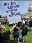  ?? AP PHOTO/MANUEL BALCE CENETA ?? Protesters gather on Capitol Hill in Washington, Saturday during a Tax Day demonstrat­ion calling on President Donald Trump to release his tax returns.