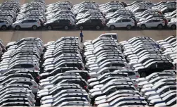  ?? (Toru Hanai/Reuters) ?? NEWLY MANUFACTUR­ED CARS awaiting export at port in Yokohama. Over much of the past year, the scope of talks has narrowed to exclude the automotive sector, the source of most of the $67b. US trade deficit with Japan.