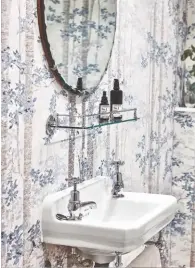  ??  ?? CLOAKROOM A bold wallpaper choice makes a statement here.
Bosky wallpaper in Blue Yonder by Lewis & Wood, £70.81m, Jane Clayton. Find a similar antique mirror at 1stdibs. Gallery shelf, £68, Hudson Reed