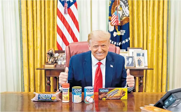  ??  ?? Donald Trump posed with a range of Goya products in the Oval Office after his daughter Ivanka tweeted a photo of herself with a can of its black beans