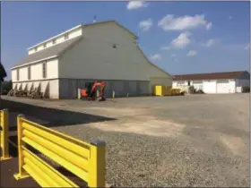  ?? EVAN BRANDT — DIGITAL FIRST MEDIA ?? Along with the new public works garage came a new salt shed with enough capacity to handle Limerick’s 110 miles of roadway. Beyond the salt shed is the former highway garage.
