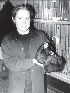  ?? 01_B02twe04 ?? Reserve Overhead Champion at the Chookie Show, first-time exhibitor Karen Curzons won the best hen and best overall bird in large and fowl and bantam section with her Pekin Bantam. Karen also took the second and third prizes in the same class.