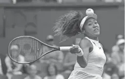  ?? KIRSTY WIGGLESWOR­TH/AP ?? Naomi Osaka pulled out of Wimbledon on Saturday, citing a lingering problem with her left Achilles tendon.