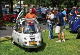  ?? CARL HESS - FOR MEDIANEWS GROUP ?? It wouldn’t be a car show without mascots, and I can certainly relate to this one! The “Micro Orphans” like this Heinkel Kabine always attract a lot of interest from those in attendance.