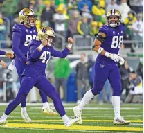  ?? ANDY NELSON/ASSOCIATED PRESS FILE PHOTO ?? Pac-12 teams Washington, above, and Oregon announced Friday they are joining the Big Ten, and the Big 12 picked up Arizona, Arizona State and Utah. The Pac-12 will be left with four teams.