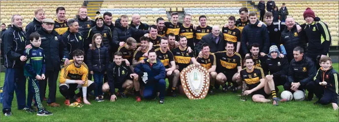 ??  ?? Dr Crokes Captain Daithi Casey and his team and management celebrate after his side defeated An Ghealtacht and Man of the Match Award to Brian Looney in the Kerry County League final at Lewis Road, Killarney on Sunday Photo by Michelle Cooper Galvin