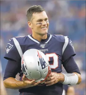 ?? Elise Amendola / Associated Press ?? Patriots quarterbac­k Tom Brady begins his 20th season in the NFL fresh off his sixth Super Bowl win.