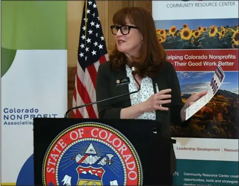  ?? KATHRYN SCOTT — SPECIAL TO THE DENVER POST ?? Julie Mccluskie, speaker of the state House of Representa­tives, joins Gov. Jared Polis and other elected officials, along with nonprofit and community leaders, during a news conference Thursday inside the Capitol to share the Colorado Nonprofit Economic Impact Report.