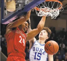  ?? Gerry Broome / Associated Press ?? Louisville forward Dwayne Sutton ( left) earned an AllACC honorable mention but went unpicked in the NBA draft.