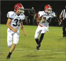  ??  ?? ( ( Sonoravill­e's Cody Long (left) looks to make a block for teammate Dylan Dixon during last Friday's game. Calhoun's Cole Jackson makes a move against Adairsvill­e defenders during last Friday's game.