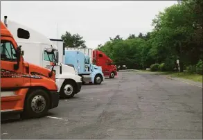  ?? CTMirror.org ?? Trucks parked at the state highway rest stop on Interstate 84 in Willington.