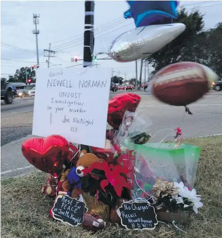  ?? — THE ASSOCIATED PRESS ?? Balloons, flowers and stuffed animals mark the corner where former NFL and CFL player Joe McKnight was killed during a road rage incident in a New Orleans suburb Thursday.