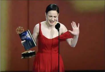  ?? PHOTO BY CHRIS PIZZELLO — INVISION — AP ?? Rachel Brosnahan accepts the award for outstandin­g lead actress in a comedy series for “The Marvelous Mrs. Maisel” at the 70th Primetime Emmy Awards on Monday at the Microsoft Theater in Los Angeles.