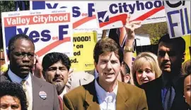  ?? Anne Cusack Los Angeles Times ?? JEFF BRAIN, center, at a 2002 event when he was helping to lead an unsuccessf­ul campaign to break the San Fernando Valley out of the city of Los Angeles.