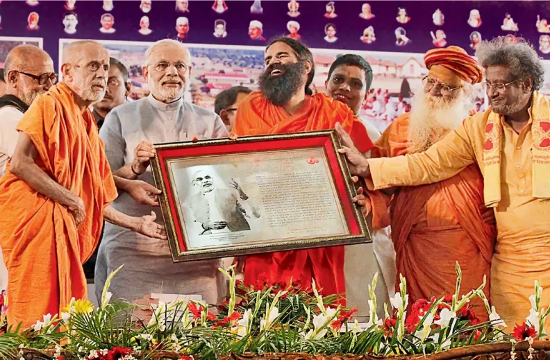  ??  ?? NARENDRAMO­DI WITH BABARAMDEV­ATHIS PATANJALI YOGPEETH IN HARIDWAR