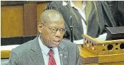  ?? Picture: RODGER BOSCH/AFP ?? SITUATION UPDATE: Health minister Zweli Mkhize addresses parliament on the virus