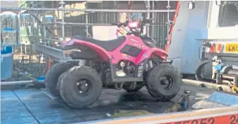  ??  ?? The quad bike loaded on to the back of a truck after being confiscate­d in Methil.