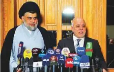  ?? AFP ?? Moqtada Al Sadr and Haider Al Abadi at the press conference in Najaf on Saturday