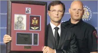  ?? COLLEEN DE NEVE/ CALGARY HERALD ?? Pat Hartigan, left, and Calgary Police Service Acting Staff Sgt. Doug Crippen are asking for the public’s help to find Second World War War medals stolen from Hartigan’s home in July.