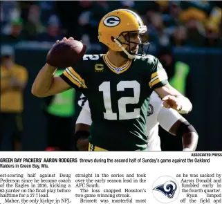  ?? ASSOCIATED PRESS ?? GREEN BAY PACKERS’ AARON RODGERS Raiders in Green Bay, Wis. throws during the second half of Sunday’s game against the Oakland