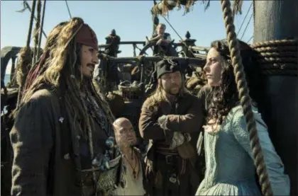  ??  ?? PETER MOUNTAIN/DISNEY VIA AP In this image released by Disney, Johnny Depp portrays Jack Sparrow, left, and Kaya Scodelario portrays Carina Smyth, right, in a scene from “Pirates of the Caribbean: Dead Men Tell No Tales.”