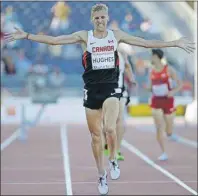  ?? AP PHOTO ?? Canada’s Matt Hughes celebrates after winning the finals of the men’s 3,000metre steeplecha­se Tuesday at the Pan Am Games in Toronto.
