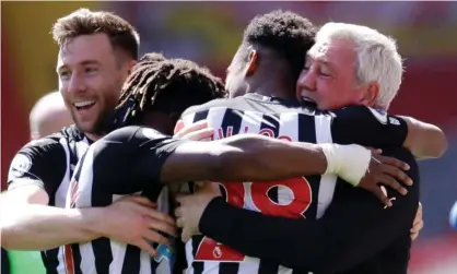  ??  ?? Steve Bruce hugs Joe Willock (No 28) after the midfielder’s late equaliser at Anfield. Willock has scored in each of his last six games. Photograph: David Klein/Reuters