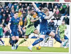  ?? ?? EFFORT: Emmanuel Osadebe sees his shot blocked by Aden Flint