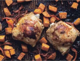  ?? ANDREW SCRIVANI NEW YORK TIMES ?? Chicken, bell peppers and sweet potatoes are roasted on a sheet pan, then sparked with pickled onions.