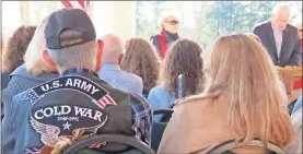  ?? / Tamara Wolk ?? Honorees at the annual Catoosa Citizens’ and Veterans’ Memorial Tribute to America did not know they had been chosen until the moment it was an-nounced at the event. James Thompson covers his mouth as he realizes he has been chosen as Walker County Veteran of the Year and his wife captures his reaction on her phone.