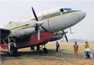  ?? PHOTO COURTESY OF THE ROYAL THAI AIR
FORCE ?? Chiang Mai airport workers inspect a Royal Thai Air Force BT67 aircraft which skidded off the runway while
landing at the airport yesterday.
The plane had been sent to the northern province
to help battle the haze crisis
there.