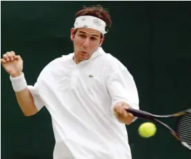  ??  ?? LONDON: This file photo taken on June 25, 2002 shows French Jerome Golmard playing a forehand during the first round match against Czech Jan Vacek at the Wimbledon Tennis Championsh­ips. Golmard died of the Charcot disease aged 43, the French Federation...