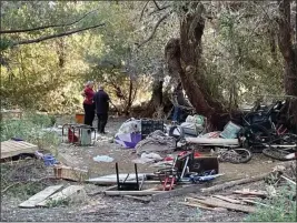  ?? COURTESY PHOTOS ?? The City of Lakeport’s Lakeport Police Department and Lakeport Public Works Department partner to clean up a significan­t homeless encampment from public property along the shoreline of Clear Lake in Lakeport this week.