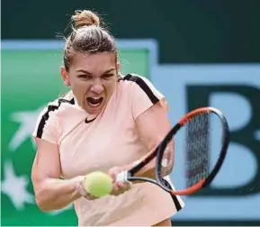  ?? AFP PIC ?? Simona Halep hits a backhand to Wang Qiang in the Paribas Open in California on Tuesday.