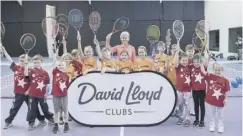  ??  ?? 0 Murray with budding tennis players at the David Lloyd centre.