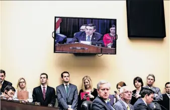  ?? Drew Angerer / New York Times ?? Congressme­n and staffers listen to opening statements from Rep. Darrell Issa, R-Vista (San Diego County) at a committee hearing on the Benghazi attack that killed the U.S. ambassador.