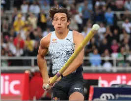  ?? DAVID LIDSTROM — GETTY IMAGES ?? American-born Armand Duplantis, who represents Sweden, cleared 20 feet, 2 1/2 inches on Thursday in Stockholm to improve on his own outdoor pole vault world record.