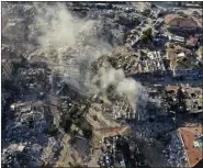  ?? HUSSEIN MALLA — THE ASSOCIATED PRESS ?? Destroyed buildings are seen from above in Antakya, southeaste­rn Turkey, Thursday, Feb. 9, 2023. The Turkish government has for years tempted fate by not enforcing modern constructi­on codes at the same time it was allowing — and in some cases, encouragin­g — a real estate boom in earthquake-prone areas, according to experts in geology and engineerin­g who repeatedly issued warnings.