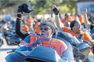  ?? WILLIE J. ALLEN JR./ORLANDO SENTINEL ?? Sandra Wallace, of Charlotte, North Carolina, cheers with the 300 female motorcycli­sts that participat­ed in the Bessie Stringfiel­d All Female Ride. The event will be featured in a documentar­y about Stringfiel­d.