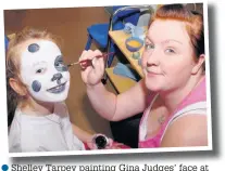  ??  ?? Shelley Tarpey painting Gina Judges’ face at the Meadowfiel­ds Children centre fun day