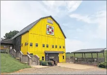  ??  ?? A fully restored historic barn welcomes visitors to Yellow Butterfly Winery.