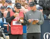  ?? ANDY BUCHANAN/GETTY ?? Talor Gooch, right, waits on the 16th tee during his second round at the British Open on Friday.
