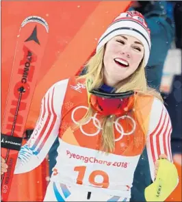  ?? Andreas Rentz Getty Images ?? MIKAELA SHIFFRIN of the United States is all smiles after winning a silver medal in the women’s Alpine combined competitio­n.